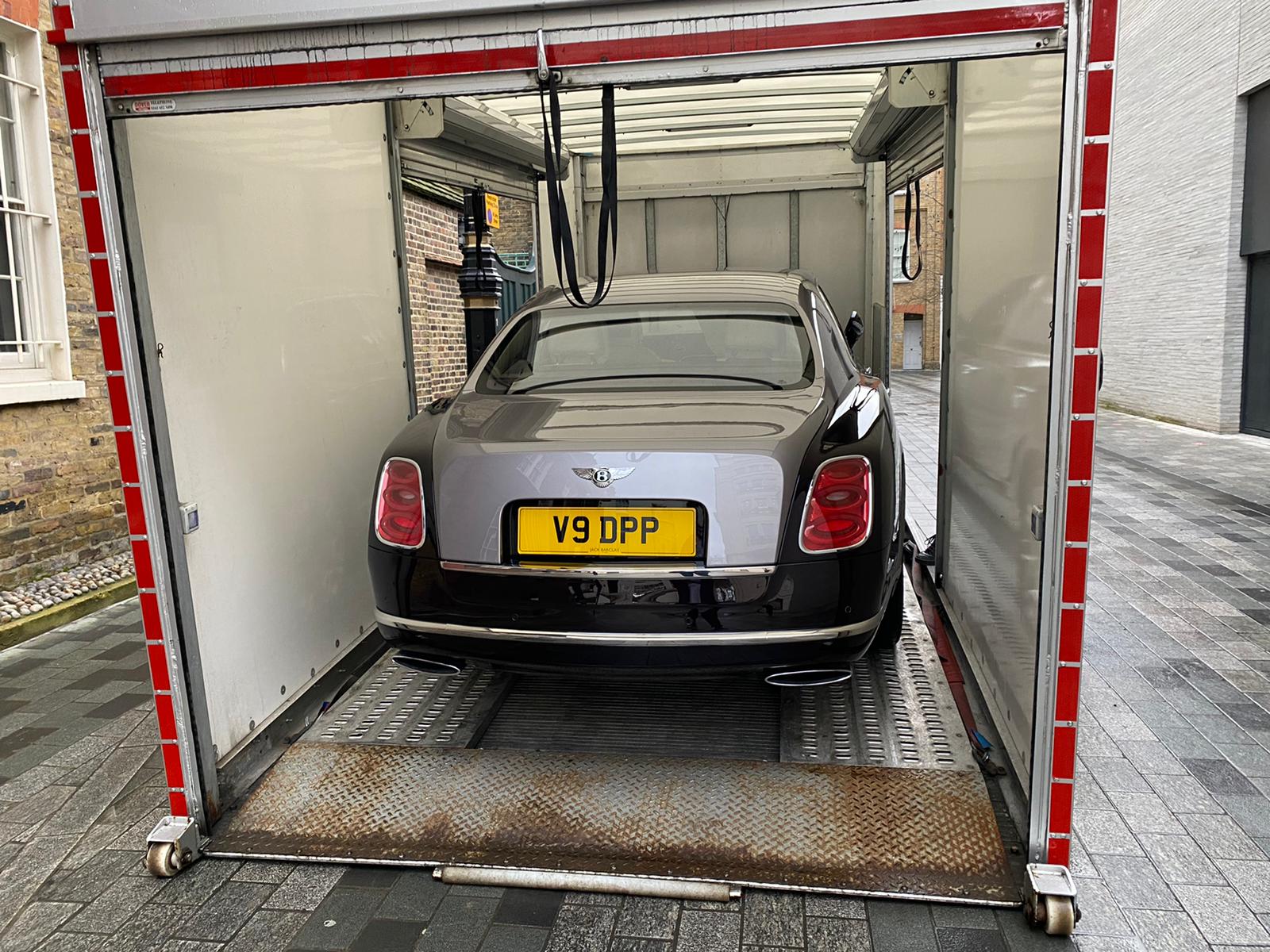 Dark Bentley secured inside an enclosed transporter